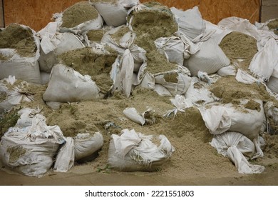 Texture Of Broken Barricade Wall Made Of White Sandbags For War Purposes. Defense Concept Background Bags To Strengthen The Defensive Structure During The Battle.