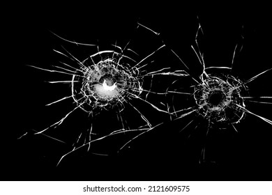 Texture Of Broken Glass. Hole From A Ball On A Black Background.