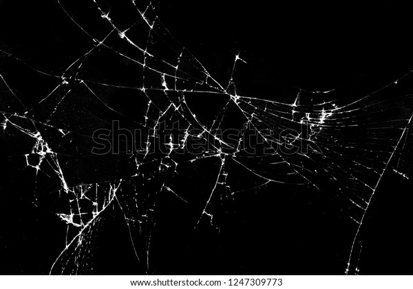 Texture of broken glass on a black background.\
Concept of broken automotive glass, screen phone, tablet, laptop.\
Flat lay, top view.