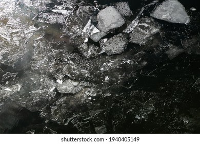 Texture. Broken Ice On Dark Water. Above The Glare Of The Bright Sun. The Dark Key. 