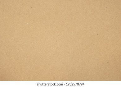 Texture of brown craft or kraft paper background, cardboard sheet, recycle paper, copy space for text.