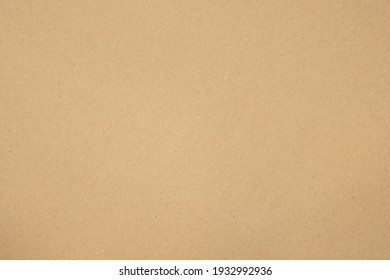 Texture of brown craft or kraft paper background, cardboard sheet, recycle paper, copy space for text. - Shutterstock ID 1932992936