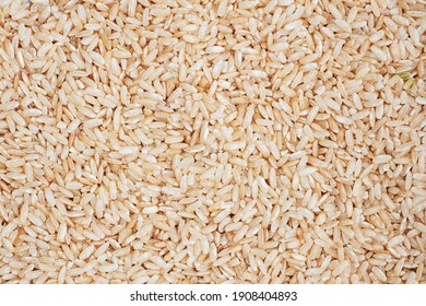 Texture Brown Rice Raw Long Grain. Background Close Up