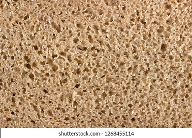 texture of brown rye bread, pie, cake, edible finely porous texture