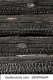 Texture Of Burnt Log House Wall. Wood And Fire.