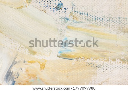 The texture of the canvas, coated with oil paints. Light pastel colors, copy space. The concept of a creative atmosphere, artistic events, education, etc.