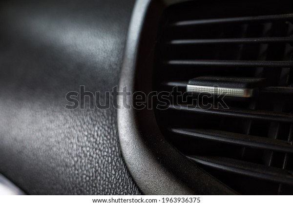 the\
texture of the car ac window with metal\
levers