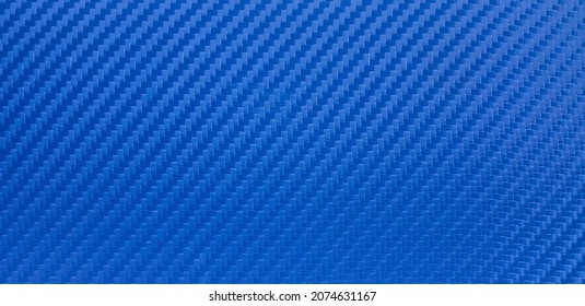 The Texture Of Carbon Fiber Is Blue. Blue Background Of Vinyl Film With Carbon Fiber Texture. Rectangular Banner For Racing-themed Text.