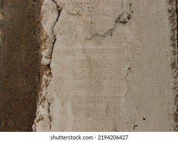 A Texture Of The Cement Wall Outside The Building That Has Begun To Peel And Crack.