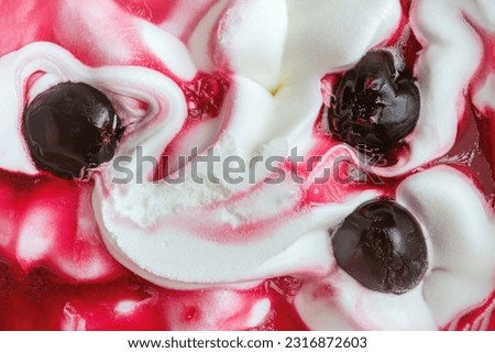 Texture of cherry ice cream. Fresh and delicious ice cream with cherries is a tasty treat for children and adults.