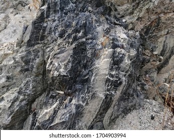 Texture Of Chert Rock In The Nature. Chert Is A Sedimentary Rock Composed Of Microcrystalline Or Cryptocrystalline Quartz, The Mineral Form Of Silicon Dioxide.