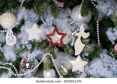 Texture of Christmas tree with different christmas toys. Coniferous tree with decorative adornments to create festive mood during holidays. Close up. - Shutterstock ID 2053011191