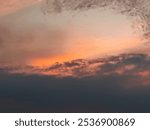 the texture of the clouds is colorful reddish orange in the afternoon