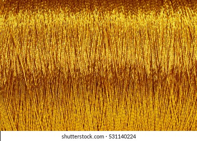 the texture of the coils of Golden thread closeup