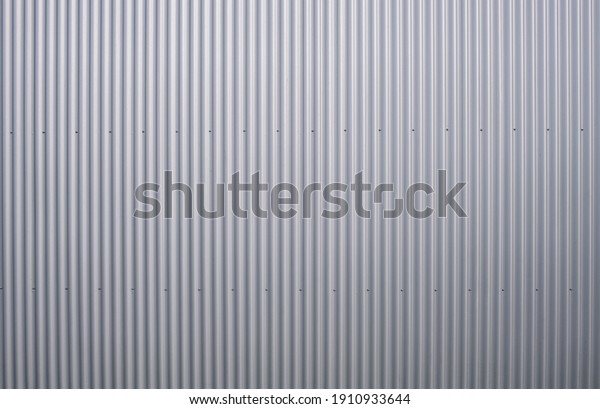 Texture of a\
corrugated sheet metal aluminum\
facade