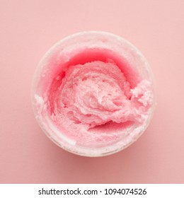 Texture Cosmetic Scrub For Face And Body Pink Sugar. Selective Focus, Trendy Punchy Pastel Background