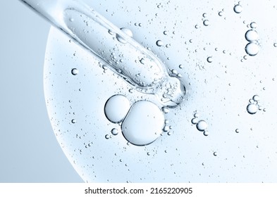 The texture of a cosmetic serum with a pipette closeup. Macrophotography - Shutterstock ID 2165220905