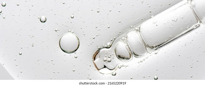 The texture of a cosmetic serum with a pipette closeup. Macrophotography - Shutterstock ID 2165220919