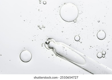 The texture of a cosmetic serum with a pipette closeup. Copy space - Powered by Shutterstock