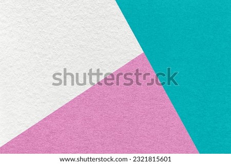Texture of craft white, pink and cyan shade color paper background, macro. Structure of vintage abstract cardboard with geometric shape and gradient. Felt backdrop closeup.