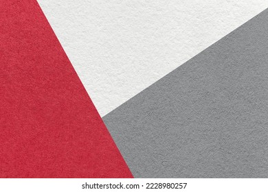 Texture of craft white, red and gray shade color paper background, macro. Structure of vintage wine abstract cardboard with geometric shape and gradient. Felt backdrop closeup.