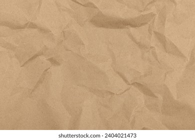Texture of crumpled craft paper. Paper background.
