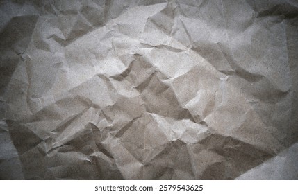 The texture of the crumpled paper is light in color. A high-resolution photo of crumpled paper.