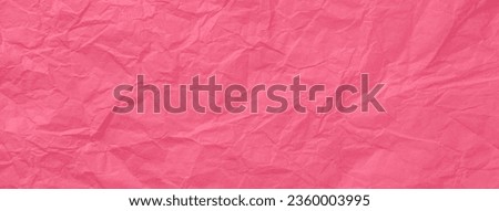 Texture of crumpled pink wrapping paper, closeup. Red old background