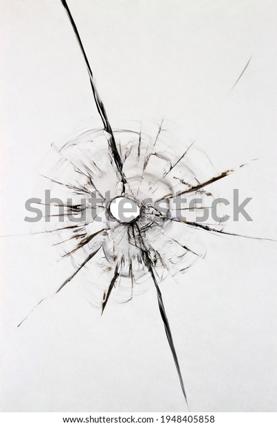 Texture of a damaged windshield ball.\
Cracked broken glass for design on a white\
background.