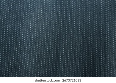 The texture of the dark colored fabric with a pattern of small dots arranged neatly, gives a modern and minimalist impression.