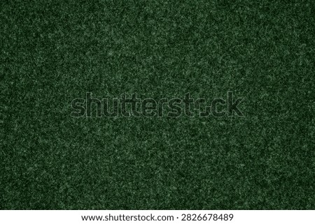 texture of dark green wool felt with dense uniform fuzz matte finish and even cloth weave of soft compressed fibers