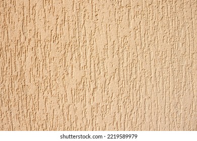 Texture of decorative plaster with a relief. Beige plaster. Close-up. - Shutterstock ID 2219589979