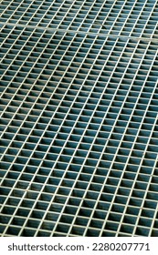 Texture design image used for details and metal grate   geometric square pattern vent drain  Used for background picture purposes in late afternoon shade in industrial areas 