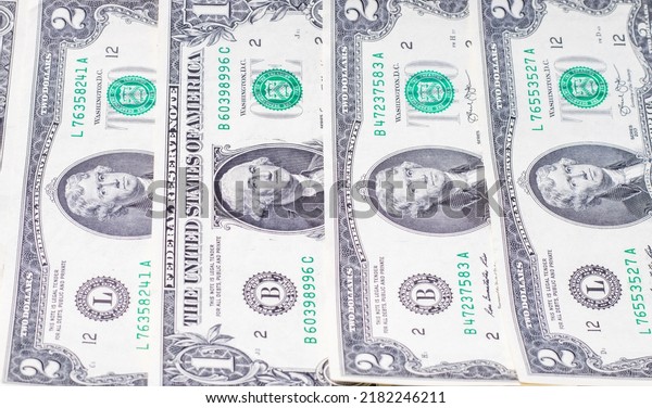 texture of dollars bills.one and two dollars\
banknote in a row arrangement .financial,business concept,money\
saving,trip,repair bye house,rent a car.pay for\
life,medicine,studies.american\
dollars