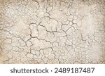 Texture of the dried earth with clay and sand, close-up or Brown dry soil or cracked ground texture background.