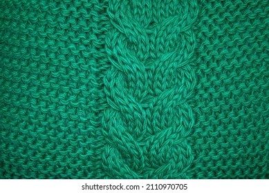 Texture Of Emerald Knitted Sweaters Ornament. Chain Cable Stitch Knit Fabric Background Close Up, Soft Focus