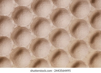 Texture of empty cardboard box for big passionate eggs  or fruits.  Pulp packaging textured background. Recycled egg carton box background - Powered by Shutterstock