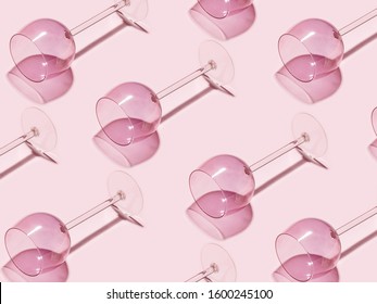 Texture Of Empty Wine Glasses On A Pink Background. Creative Minimalistic Concept.