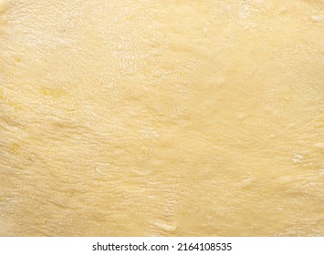 Texture of evenly rolled dough.Background of the dough for baking. High quality photo