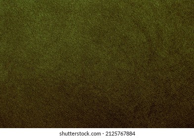 The texture of the fabric is dark green velor. Background Velvet furniture