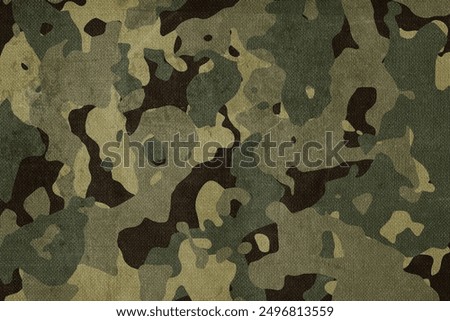 Texture of fabric with military camouflage. Military theme background.