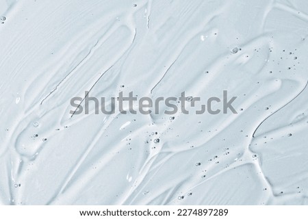 Texture of face serum. Abstract background of moisturising transparent gel. 