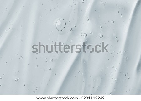 Texture of face serum. Abstract background of moisturising transparent gel. 