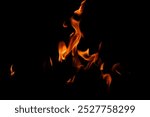 Texture of fire on black background. Abstract fire flame background. Large burning fire. Blaze fire flame texture background.