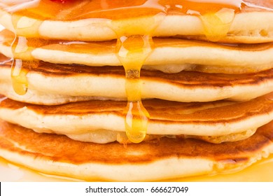 Texture of fresh pancakes with fragrant maple syrup and honey.