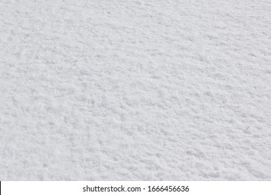 Texture Of Fresh Snow Covering The Ground In Winter .