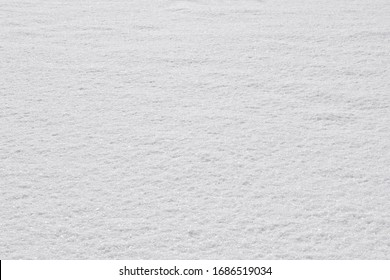 Texture Of Fresh Snow Covering The Ground In Winter .