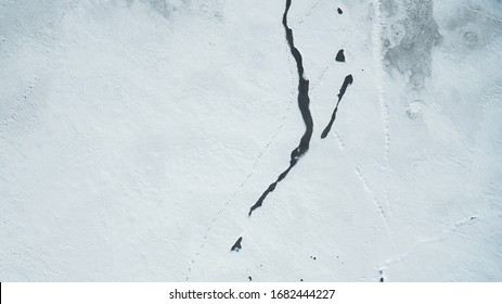 Texture of Frozen Lake Covered with snow Aerial Vertical Top-Down View - Powered by Shutterstock