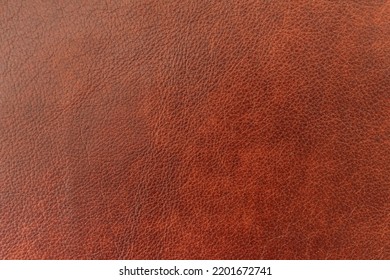 Texture of genuine leather close-up, brown color, background, pattern for backdrop. Manufacturing of leather accessory concept - Shutterstock ID 2201672741