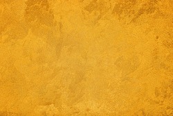 Texture Of Golden Decorative Plaster Or Concrete. Abstract Grunge Background For Design.